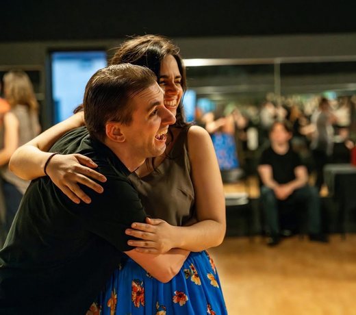 Ben mid-dance, both partners laughing