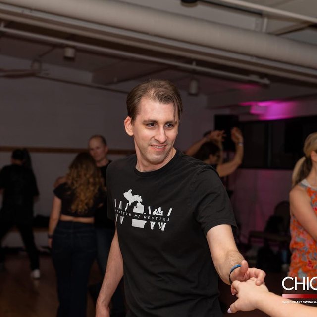 Ben reaching for his partner’s hand on the slot